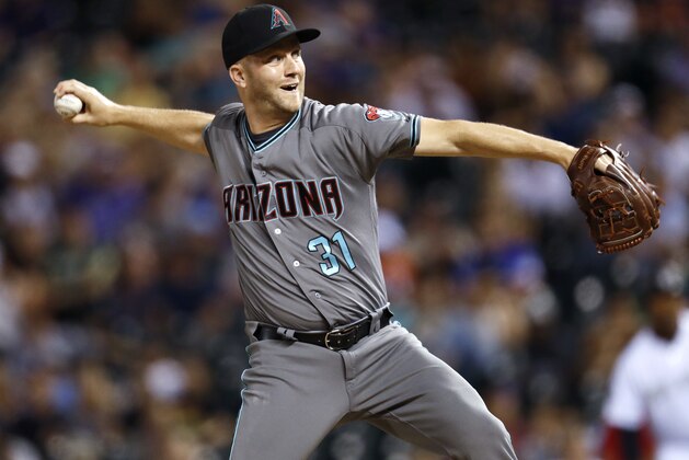 Arizona Diamondbacks relief pitcher Brad Boxberger works against a Colorado Rockies batter during the ninth inning of a baseball game Tuesday, July 10, 2018, in Denver. The Diamondbacks won 5-3. (AP Photo/David Zalubowski)