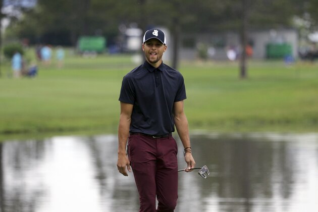 Golden State Warriors NBA basketball player Stephen Curry walks up the second fairway during the first round of the American Century Championship golf tournament at the Edgewood Tahoe Golf Course in Stateline, Nev., Friday,  July 13, 2018. (AP Photo/Lance Iversen)