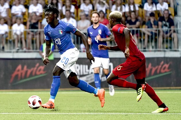 Italy's Moise Kean and Portugal's Florentino battle for the ball during the European Under-19 Championship soccer final match between Italy and Portugal in Seinajoki, Finland, Sunday July 29, 2018. (Timo Aalto/Lehtikuva via AP)
