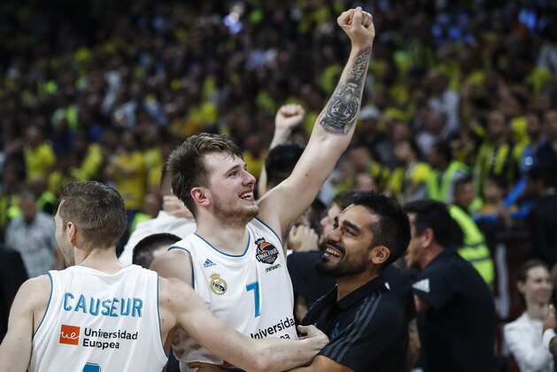 BELGRADE, SERBIA - MAY 20: Luka Doncic (C) and Fabien Causeur (L) of Real Madrid celebrate victory after the Turkish Airlines Euroleague Final Four Belgrade 2018 Final match between Real Madrid and Fenerbahce Istanbul Dogus at Stark Arena on May 20, 2018 in Belgrade, Serbia. (Photo by Srdjan Stevanovic/Getty Images)