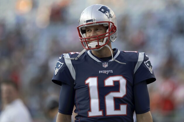 New England Patriots quarterback Tom Brady smiles as he takes the field to warm up before a preseason NFL football game against the Washington Redskins, Thursday, Aug. 9, 2018, in Foxborough, Mass. (AP Photo/Charles Krupa)