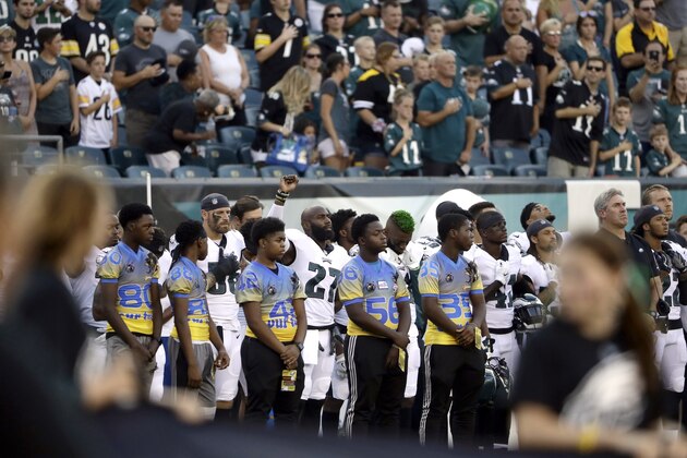 Philadelphia Eagles' Malcolm Jenkins, center left, raises his fist during the national anthem before the team's preseason NFL football game against the Pittsburgh Steelers, Thursday, Aug. 9, 2018, in Philadelphia. (AP Photo/Matt Rourke)