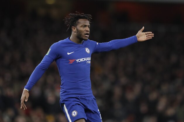 FILE - In this Wednesday, Jan.24, 2018 file photo, Chelsea's Michy Batshuayi gestures during the English League Cup semifinal second leg soccer match between Chelsea and Arsenal at the Emirates stadium in London. Michy Batshuayi has joined Borussia Dortmund on loan from Chelsea until the end of the season. The Belgium striker's move completes a triangle of transfers that saw Arsenal sign Pierre-Emerick Aubameyang from Dortmund and sell Olivier Giroud to Chelsea earlier on Wednesday, Jan. 31, 2018. (AP Photo/Matt Dunham, file)