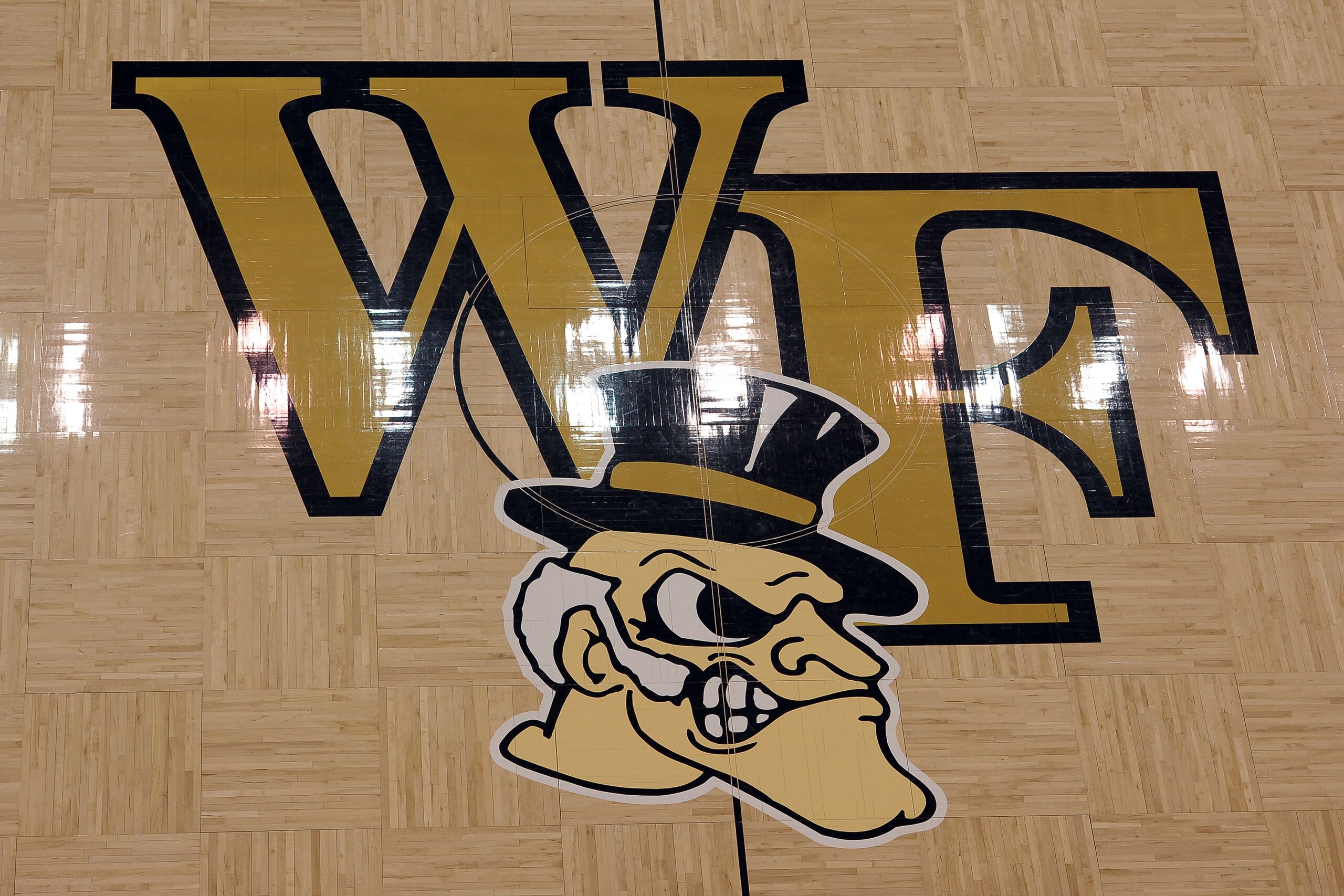 WINSTON-SALEM, NC - JANUARY 29: A view of the Wake Forest logo prior to a game between the Syracuse Orange and the Wake Forest Demon Deacons at Lawrence Joel Coliseum on January 29, 2014 in Winston-Salem, North Carolina. Syracuse defeated Wake Forest 67-57. (Photo by Lance King/Getty Images)