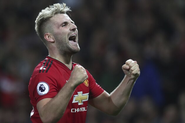 Manchester United's Luke Shaw celebrates after scoring his sides second goal of the game during the English Premier League soccer match between Manchester United and Leicester City at Old Trafford, in Manchester, England, Friday, Aug. 10, 2018. (AP Photo/Jon Super)