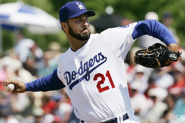 FILE - In this Friday, March 14, 2008, file photo, Los Angeles Dodgers starting pitcher Esteban Loaiza winds up during the first inning of a spring training baseball game in Vero Beach, Fla. Former All-Star pitcher Loaiza is facing a federal charge that he possessed cocaine intended for sale. Loaiza's drug case was moved Wednesday, March 7, 2018, from state to federal court. He pleaded not guilty to the earlier charges and remains jailed. (AP Photo/Orlin Wagner, File)