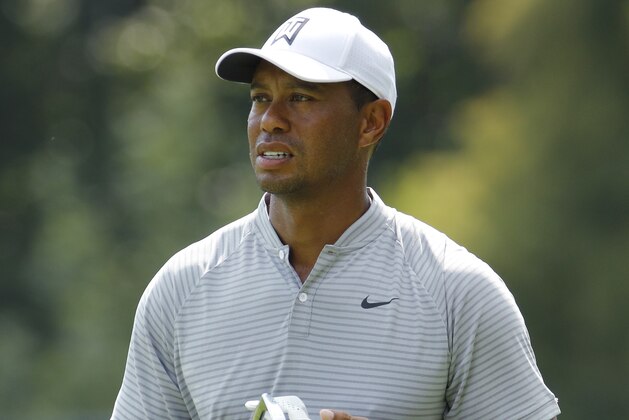 Tiger Woods pauses as he walks to the eighth green during the second round of the PGA Championship golf tournament at Bellerive Country Club, Friday, Aug. 10, 2018, in St. Louis. (AP Photo/Charlie Riedel)