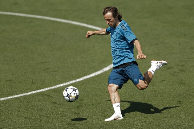 Real Madrid's Luka Modric shoots the ball during a training session in the open media day at the team's Veldebebas training ground in Madrid, Tuesday, May 22, 2018. Real Madrid will play the Champions League final match against Liverpool on Saturday 26. (AP Photo/Francisco Seco)