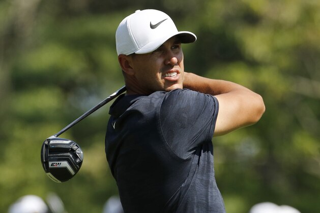 Brooks Koepka watches his shot from the fourth tee during the second round of the PGA Championship golf tournament at Bellerive Country Club, Friday, Aug. 10, 2018, in St. Louis. (AP Photo/Charlie Riedel)