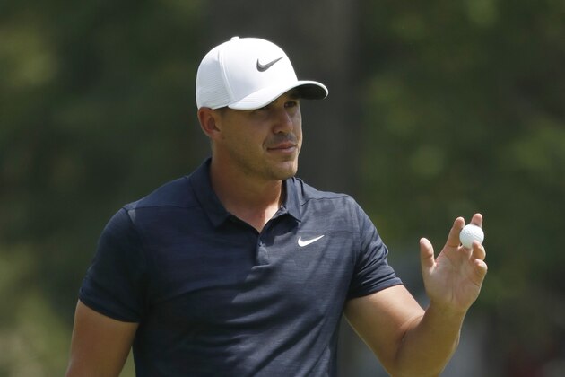 Brooks Koepka holds his ball on the ninth green during the second round of the PGA Championship golf tournament at Bellerive Country Club, Friday, Aug. 10, 2018, in St. Louis. (AP Photo/Brynn Anderson)