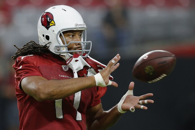 Arizona Cardinals wide receiver Larry Fitzgerald reaches out to make a catch during an NFL football practice Thursday, Aug. 9, 2018, in Glendale, Ariz. (AP Photo/Ross D. Franklin)