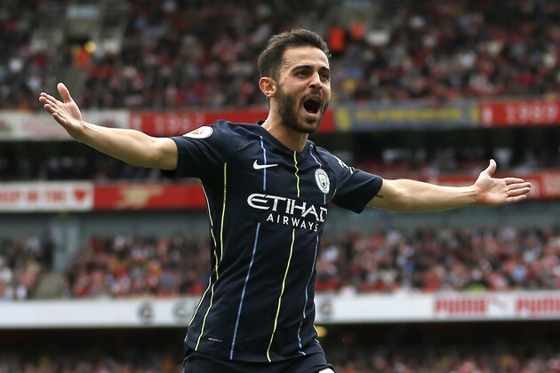 Manchester City's Portuguese midfielder Bernardo Silva celebrates after scoring their second goal during the English Premier League football match between Arsenal and Manchester City at the Emirates Stadium in London on August 12, 2018. (Photo by Ian KINGTON / IKIMAGES / AFP) / RESTRICTED TO EDITORIAL USE. No use with unauthorized audio, video, data, fixture lists, club/league logos or 'live' services. Online in-match use limited to 45 images, no video emulation. No use in betting, games or single club/league/player publications. /         (Photo credit should read IAN KINGTON/AFP/Getty Images)