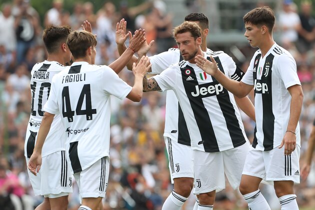 VILLAR PEROSA, ITALY - AUGUST 12:  Claudio Marchisio (C) of Juventus FC celebrates his goal with his team-mates during the Pre-Season Friendly match between Juventus and Juventus U19 on August 12, 2018 in Villar Perosa, Italy.  (Photo by Marco Luzzani/Getty Images)