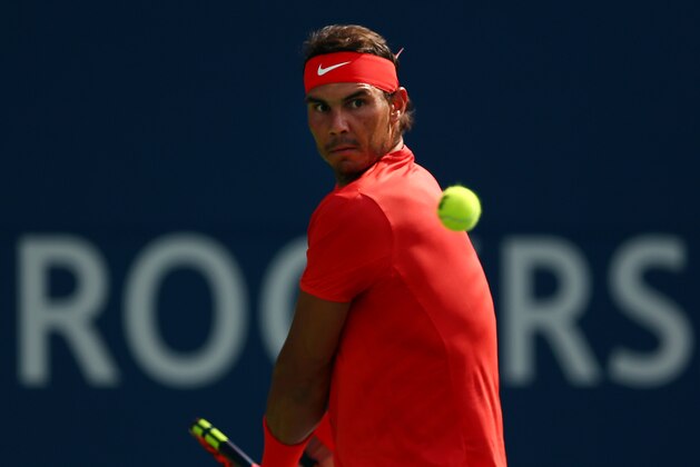 TORONTO, ON - AUGUST 12:  Rafael Nadal of Spain plays a shot against Stefanos Tsitsipas of Greece during the final match on Day 7 of the Rogers Cup at Aviva Centre on August 12, 2018 in Toronto, Canada.  (Photo by Vaughn Ridley/Getty Images)