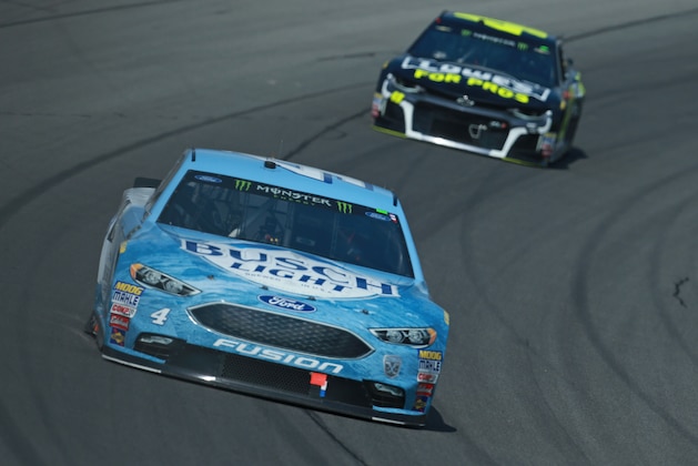 BROOKLYN, MI - AUGUST 12:  Kevin Harvick, driver of the #4 Busch Light/Mobil 1 Ford, leads Jimmie Johnson, driver of the #48 Lowe's for Pros Chevrolet, during the Monster Energy NASCAR Cup Series Consmers Energy 400 at Michigan International Speedway on August 12, 2018 in Brooklyn, Michigan.  (Photo by Sean Gardner/Getty Images)