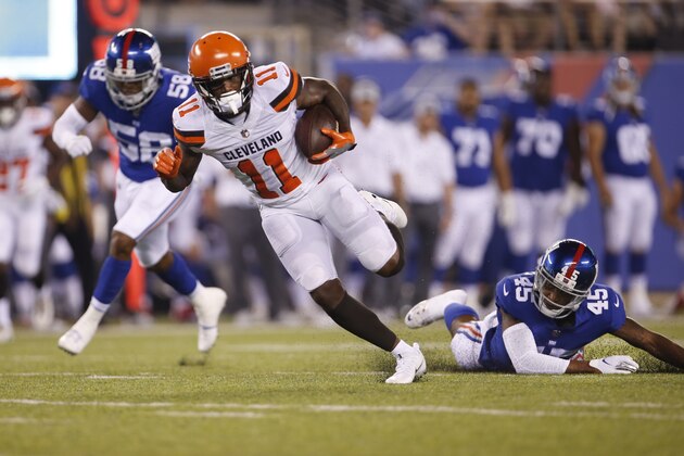Cleveland Browns wide receiver Antonio Callaway (11) runs away from New York Giants' Orion Stewart (45) and Tae Davis (58) for a touchdown during the second half of a preseason NFL football game Thursday, Aug. 9, 2018, in East Rutherford, N.J. (AP Photo/Adam Hunger)