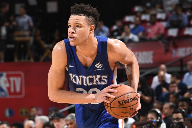 LAS VEGAS, NV - JULY 12:  Kevin Knox #20 of the New York Knicks handles the ball against the Boston Celtics during the 2018 Las Vegas Summer League on July 12, 2018 at the Thomas & Mack Center in Las Vegas, Nevada. NOTE TO USER: User expressly acknowledges and agrees that, by downloading and/or using this Photograph, user is consenting to the terms and conditions of the Getty Images License Agreement. Mandatory Copyright Notice: Copyright 2018 NBAE (Photo by Garrett Ellwood/NBAE via Getty Images)