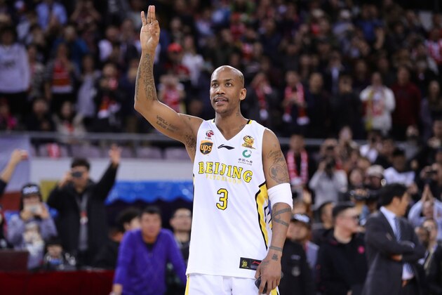 Former NBA player Stephon Marbury waves to the crowd after his final game for the Chinese Basketball Association's Beijing Fly Dragons in Beijing on February 11, 2018.
Marbury retired from pro basketball on February 11, 2018 after a 22-year career. / AFP PHOTO / - / China OUT        (Photo credit should read -/AFP/Getty Images)