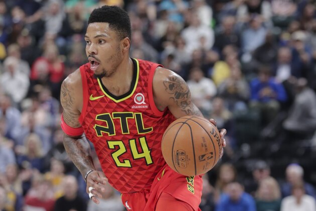 Atlanta Hawks guard Kent Bazemore (24) drives on the Indiana Pacers during the second half of an NBA basketball game in Indianapolis, Friday, Feb. 23, 2018. The Pacers defeated the Hawks 116-93. (AP Photo/Michael Conroy)