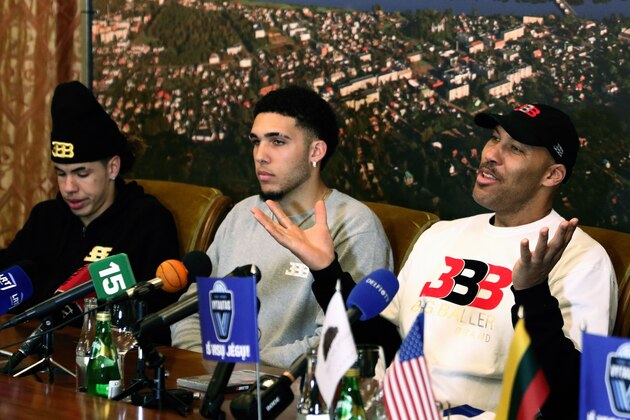 US basketball player (L-R) LaMelo Ball, LiAngelo Ball and their father LaVar Ball attend a press conference in Prienai, Lithuania, where they will play for the Vytautas club on January 5, 2018.
Basketball-crazed Lithuania welcomed LiAngelo and LaMelo Ball, the two youngest sons of flamboyant Los Angeles entrepreneur LaVar Ball who recently made headlines due to a feud with US President Donald Trump. / AFP PHOTO / Petras Malukas        (Photo credit should read PETRAS MALUKAS/AFP/Getty Images)