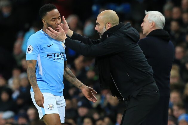 Manchester City's Spanish manager Pep Guardiola (R) gestures to Manchester City's English midfielder Raheem Sterling (L) during the English Premier League football match between Manchester City and West Bromwich Albion at the Etihad Stadium in Manchester, north west England, on January 31, 2018. / AFP PHOTO / Lindsey PARNABY / RESTRICTED TO EDITORIAL USE. No use with unauthorized audio, video, data, fixture lists, club/league logos or 'live' services. Online in-match use limited to 75 images, no video emulation. No use in betting, games or single club/league/player publications.  /         (Photo credit should read LINDSEY PARNABY/AFP/Getty Images)