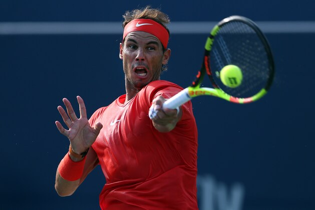 TORONTO, ON - AUGUST 12:  Rafael Nadal of Spain plays a shot against Stefanos Tsitsipas of Greece during the final match on Day 7 of the Rogers Cup at Aviva Centre on August 12, 2018 in Toronto, Canada.  (Photo by Vaughn Ridley/Getty Images)
