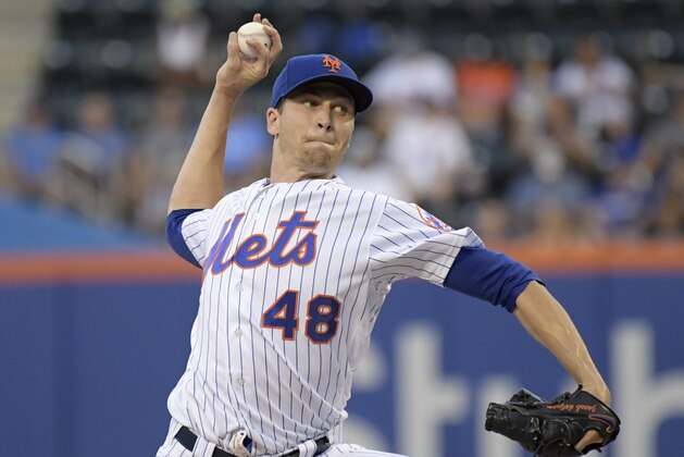 New York Mets pitcher Jacob deGrom throws during the first inning of the team's baseball game against the Atlanta Braves on Friday, Aug. 3, 2018, in New York. (AP Photo/Bill Kostroun)