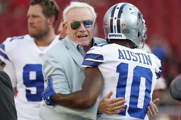 Dallas Cowboys owner Jerry Jones, center, hugs running back Tavon Austin (10) before an NFL preseason football game between the San Francisco 49ers and the Cowboys in Santa Clara, Calif., Thursday, Aug. 9, 2018. (AP Photo/Tony Avelar)