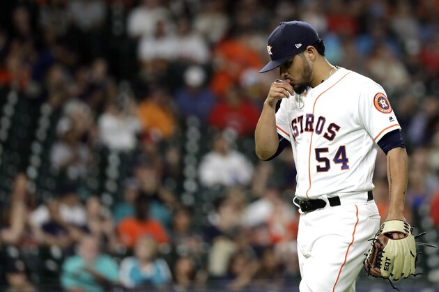 Houston Astros relief pitcher Roberto Osuna walks toward the dugout after pitching against the Seattle Mariners during the ninth inning of a baseball game Thursday, Aug. 9, 2018, in Houston. (AP Photo/David J. Phillip)