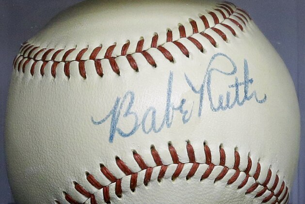 Babe Ruth's autograph is seen on a baseball that he signed in 1948, Wednesday, July 9, 2014, in Baltimore, during a media preview of sports memorabilia slated for auction to mark the 100th anniversary of Ruth's major league debut. The auction is scheduled to take place July 12, the day after the anniversary, and the organizers estimate that 125 items to be auctioned off could fetch as much as $10 million. (AP Photo/Patrick Semansky)