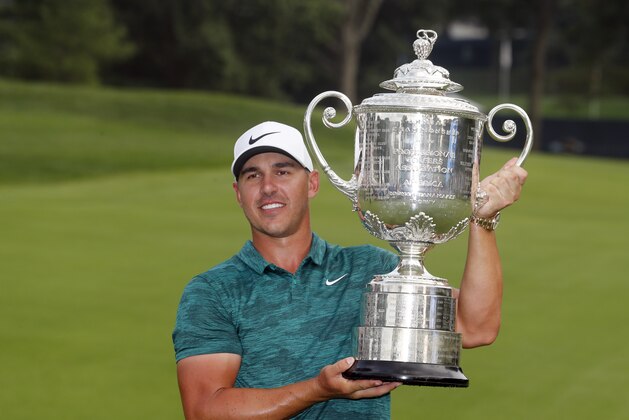 Brooks Koepka poses with the Wanamaker Trophy after winning the PGA Championship golf tournament at Bellerive Country Club, Sunday, Aug. 12, 2018, in St. Louis. (AP Photo/Jeff Roberson)