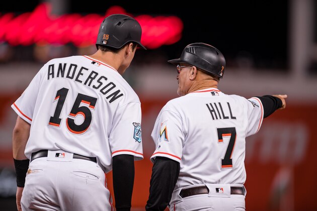 MIAMI, FL - APRIL 2: Brian Anderson #15 of the Miami Marlins talks with first base coach Perry Hill #7 during the game against the Boston Red Sox at Marlins Park on April 2, 2018 in Miami, Florida. (Photo by Rob Foldy/Miami Marlins via Getty Images)