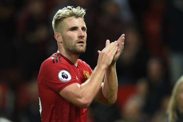 Manchester United's English defender Luke Shaw gesture after the English Premier League football match between Manchester United and Leicester City at Old Trafford in Manchester, north west England, on August 10, 2018. (Photo by Oli SCARFF / AFP) / RESTRICTED TO EDITORIAL USE. No use with unauthorized audio, video, data, fixture lists, club/league logos or 'live' services. Online in-match use limited to 120 images. An additional 40 images may be used in extra time. No video emulation. Social media in-match use limited to 120 images. An additional 40 images may be used in extra time. No use in betting publications, games or single club/league/player publications /         (Photo credit should read OLI SCARFF/AFP/Getty Images)