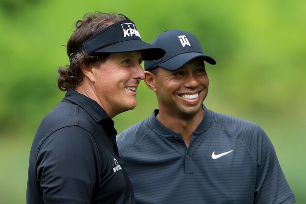 AKRON, OH - AUGUST 01:  Phil Mickelson (L) and Tiger Woods smile during a practice round prior to the World Golf Championships-Bridgestone Invitational at Firestone Country Club South Course on August 1, 2018 in Akron, Ohio.  (Photo by Sam Greenwood/Getty Images)