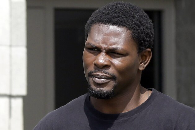 FILE - In this Aug. 27, 2014 file photo, boxer Jermain Taylor walks from the Pulaski County Jail in Little Rock, Ark. Taylor has avoided prison time on several felony charges stemming from three separate incidents in Arkansas, including firing a gun at a Martin Luther King Jr. parade. The Arkansas Democrat-Gazette reports that a Pulaski County Circuit judge on Friday, May 20, 2016, suspended Taylor's 19-year sentence. That means Taylor won't have to go to prison as long as he stays out of trouble, submits to drug testing and performs 120 hours of community service. (AP Photo/Danny Johnston, File)