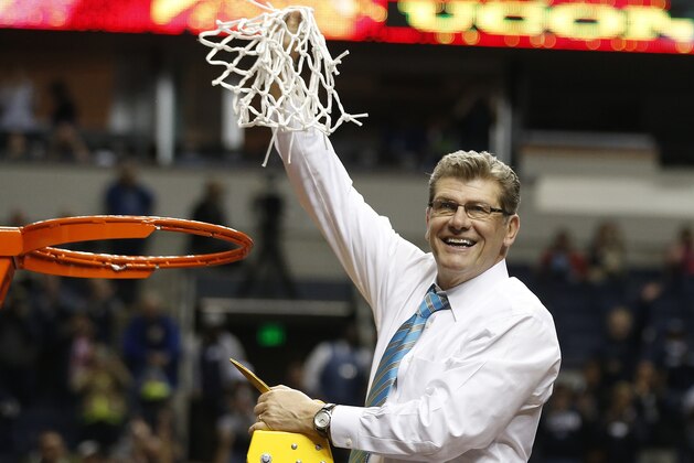 Connecticut head coach Geno Auriemma holds the net after the second half of the championship game against Notre Dame in the Final Four of the NCAA women's college basketball tournament, Tuesday, April 8, 2014, in Nashville, Tenn. Connecticut won 79-58. (AP Photo/John Bazemore)