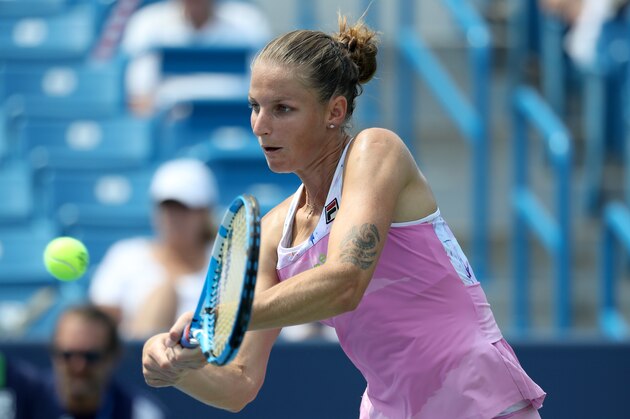 MASON, OH - AUGUST 14: Karolina Pliskova of the Czech Republic returns a shot to Agnleszka Radwanska of Poland during Day 4 of the Western and Southern Open at the Lindner Family Tennis Center on August 14, 2018 in Mason, Ohio. (Photo by Rob Carr/Getty Images)