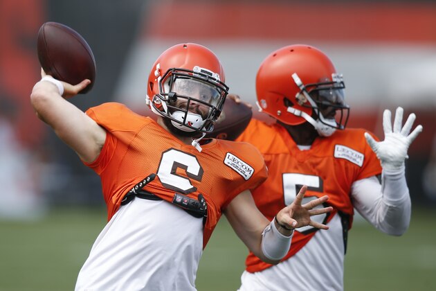 Cleveland Browns quarterbacks Baker Mayfield (6) and Tyrod Taylor (5) throw during NFL football training camp Sunday, Aug. 12, 2018, in Berea, Ohio. (AP Photo/Ron Schwane)