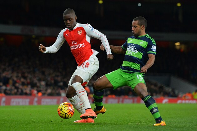 Arsenal's Costa Rican striker Joel Campbell (L) vies with Swansea City's English midfielder Wayne Routledge (R) during the English Premier League football match between Arsenal and Swansea City at the Emirates Stadium in London on March 2, 2016. / AFP / GLYN KIRK / RESTRICTED TO EDITORIAL USE. No use with unauthorized audio, video, data, fixture lists, club/league logos or 'live' services. Online in-match use limited to 75 images, no video emulation. No use in betting, games or single club/league/player publications. / (Photo credit should read GLYN KIRK/AFP/Getty Images) Arsenal's Costa Rican striker Joel Campbell (L) vies with Swansea City's English midfielder Wayne Routledge (R) during the English Premier League football match between Arsenal and Swansea City at the Emirates Stadium in London on March 2, 2016. / AFP / GLYN KIRK / RESTRICTED TO EDITORIAL USE. No use with unauthorized audio, video, data, fixture lists, club/league logos or 'live' services. Online in-match use limited to 75 images, no video emulation. No use in betting, games or single club/league/player publications. / (Photo credit should read GLYN KIRK/AFP/Getty Images)