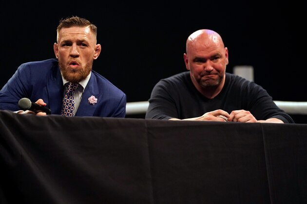 LONDON, ENGLAND - JULY 14:  (L-R) Conor McGregor interacts with the media as UFC President Dana White listens on stage during the Floyd Mayweather Jr. v Conor McGregor World Press Tour event at SSE Arena on July 14, 2017 in London, England. (Photo by Jeff Bottari/Zuffa LLC/Zuffa LLC via Getty Images)