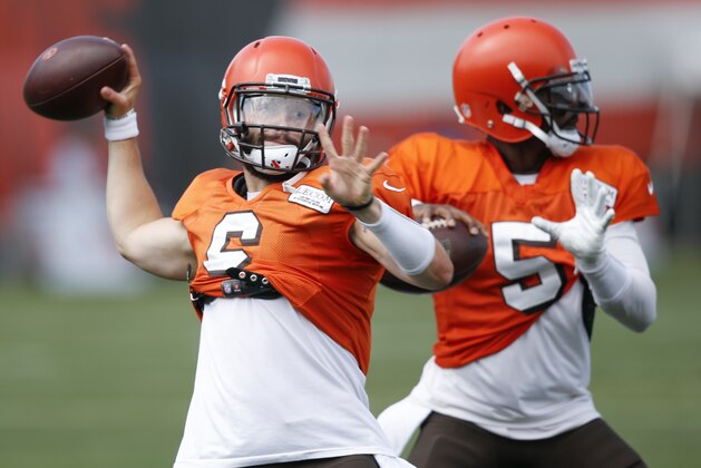 Cleveland Browns quarterbacks Baker Mayfield (6) and Tyrod Taylor (5) throw during NFL football training camp Sunday, Aug. 12, 2018, in Berea, Ohio. (AP Photo/Ron Schwane)