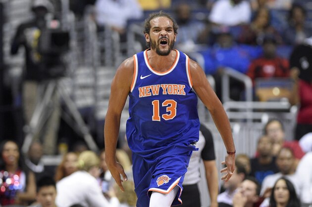 New York Knicks center Joakim Noah (13) reacts during the second half of a preseason NBA basketball game against the Washington Wizards, Friday, Oct. 6, 2017, in Washington. The Wizards won 104-100. (AP Photo/Nick Wass)