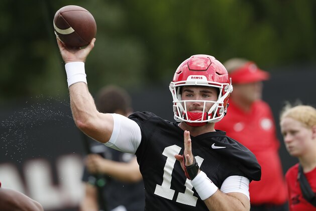 Georgia quarterback Jake Fromm (11) throws a pass during their NCAA college football training camp practice Friday, Aug. 3, 2018 in Athens, Ga. (AP Photo/John Bazemore)