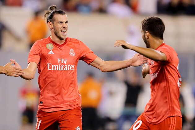 EAST RUTHERFORD, NJ - AUGUST 07:  Gareth Bale #11 of Real Madrid celebrates with Marco Asensio #20 after scoring a goal in the 15th minute against Robin Olsen #1 of Roma during the first half of the International Champions Cup match at MetLife Stadium on August 7, 2018 in East Rutherford, New Jersey.  (Photo by Elsa/International Champions Cup/Getty Images)
