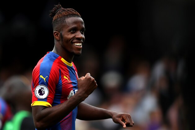 LONDON, ENGLAND - AUGUST 11:  Wilfried Zaha of Crystal Palace celebrates following his sides victory in the Premier League match between Fulham FC and Crystal Palace at Craven Cottage on August 11, 2018 in London, United Kingdom.  (Photo by Christopher Lee/Getty Images)