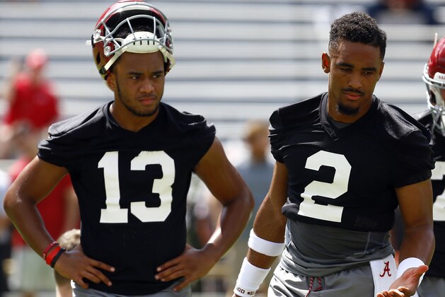 Alabama quarterback Jalen Hurts (2) and quarterback Tua Tagovailoa (13) runs drills during a NCAA college football practice, Saturday, Aug. 4, 2018, in Tuscaloosa, Ala. (AP Photo/Butch Dill)