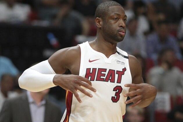 Miami Heat guard Dwyane Wade (3) looks on during the first half of an NBA basketball game against the Chicago Bulls, Thursday, March 29, 2018, in Miami. The Heat defeated the Bulls 103-92. (AP Photo/Joel Auerbach)