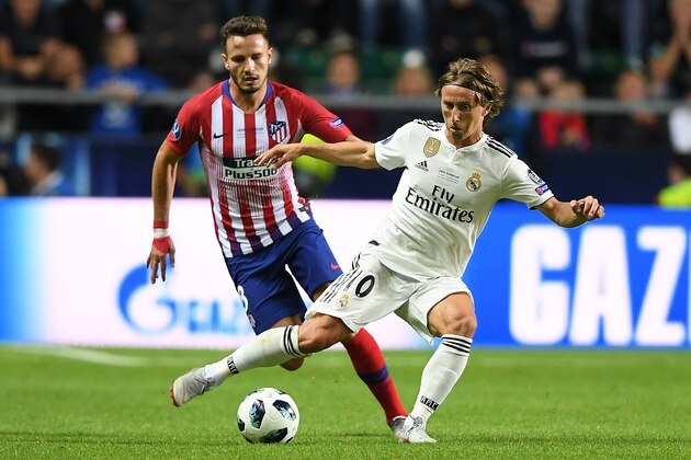 Real Madrid's Croatian midfielder Luka Modric (R) challenges Atletico Madrid's Spanish midfielder Saul Niguez during the UEFA Super Cup football match between Real Madrid and Atletico Madrid at the Lillekula Stadium in the Estonian capital Tallinn on August 15, 2018. (Photo by Janek SKARZYNSKI / AFP)        (Photo credit should read JANEK SKARZYNSKI/AFP/Getty Images)