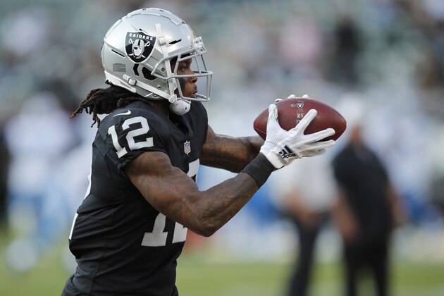Oakland Raiders wide receiver Martavis Bryant (12) warms up before an NFL preseason football game against the Detroit Lions in Oakland, Calif., Friday, Aug. 10, 2018. (AP Photo/John Hefti)