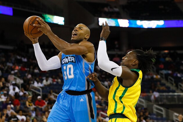 DULUTH, GA - AUGUST 10:  Corey Maggette #50 of the Power shoots a layup over Jermaine Taylor #1 of the Ball Hogs during week eight of the BIG3 three on three basketball league at Infinite Energy Arena on August 10, 2018 in Duluth, Georgia.  (Photo by Kevin C. Cox/Getty Images)